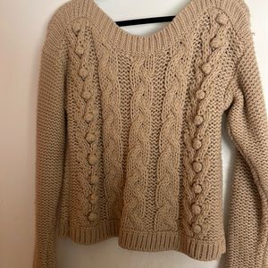 Knit sweater.